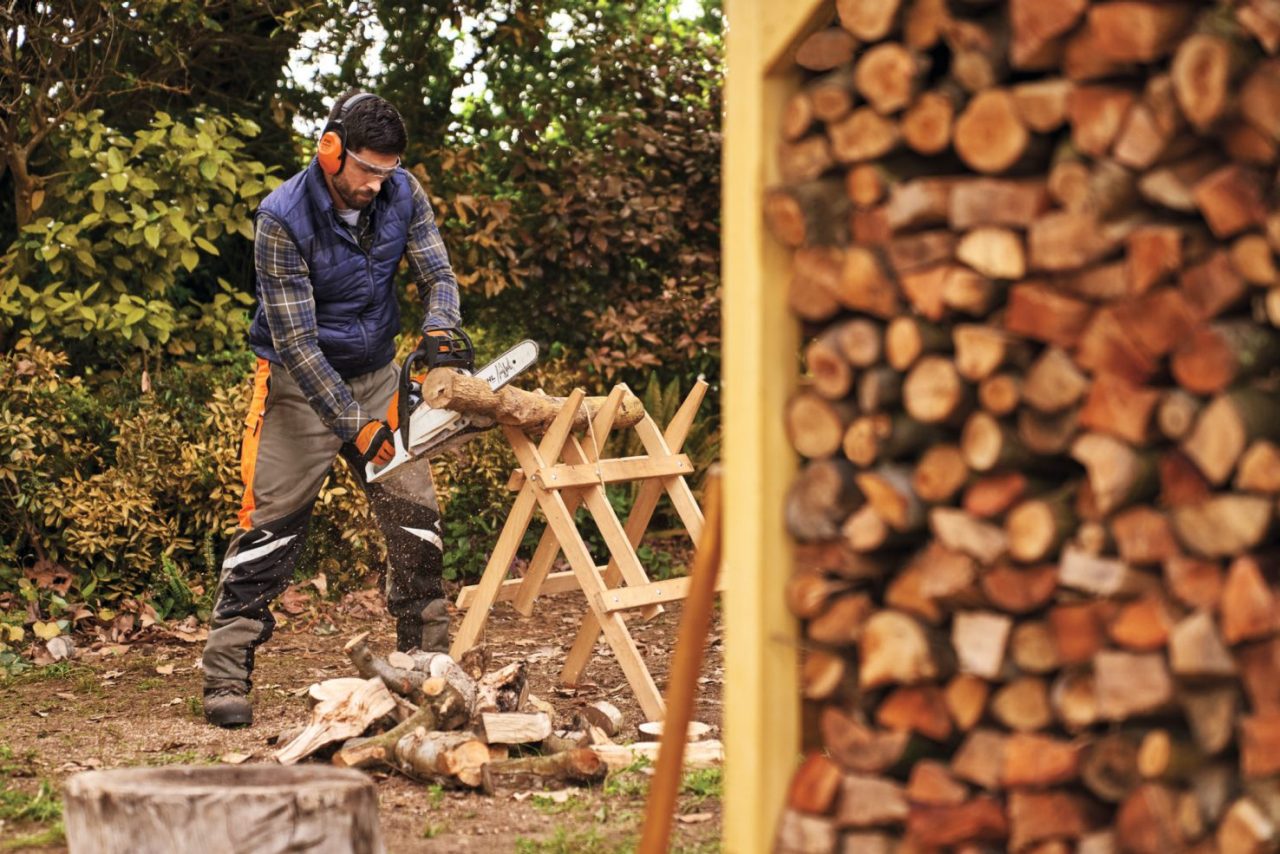 man cutting woods