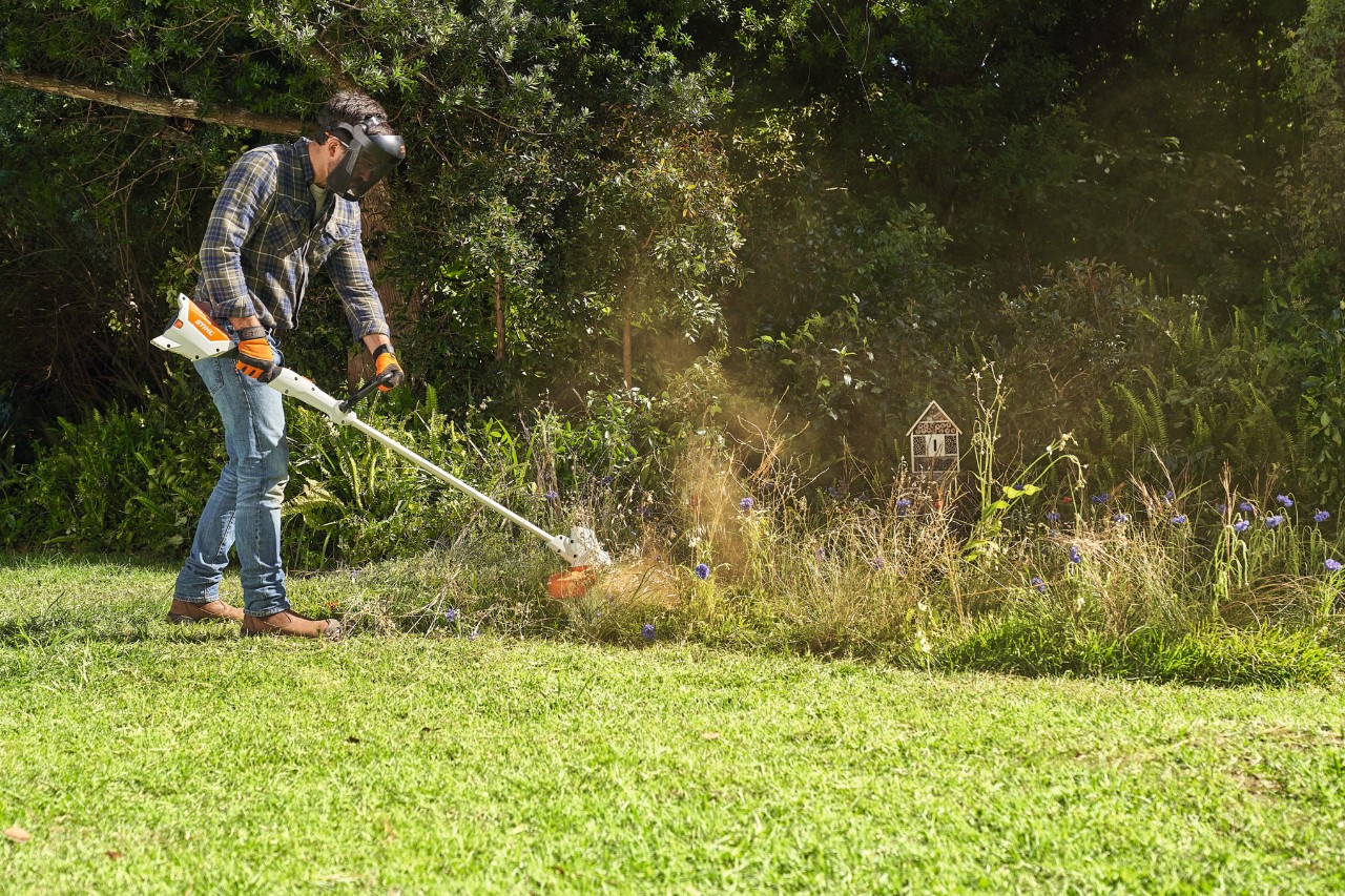 Man mows a wildflower meadow with a STIHL FSA 57